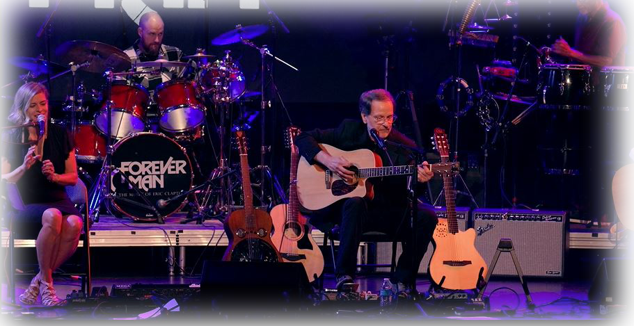 Guitarists and drummer preforming live